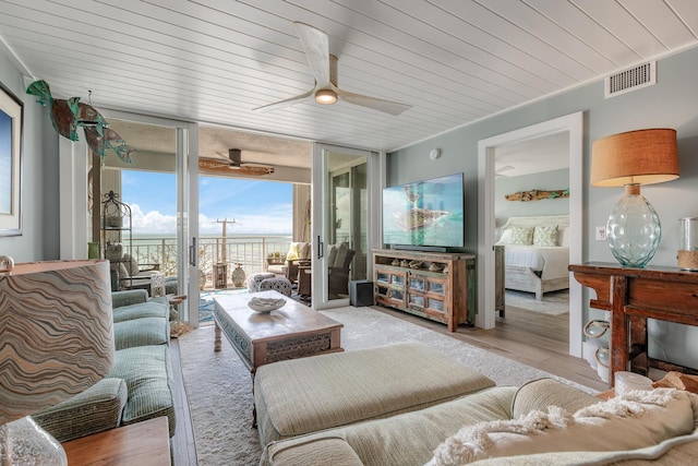 interior space featuring wooden ceiling and ceiling fan