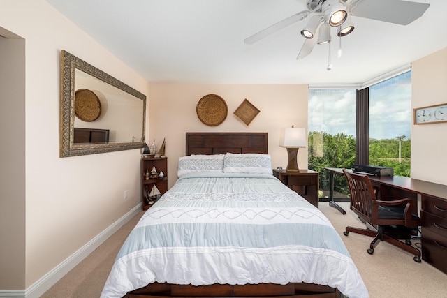 6301 Gulf Of Mexico Blvd Unit 301, Marathon, FL 33050 - bedroom featuring ceiling fan, expansive windows, baseboards, and light colored carpet