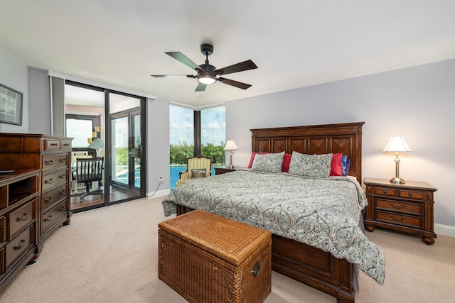 6301 Gulf Of Mexico Blvd Unit 301, Marathon, FL 33050 - bedroom featuring light carpet, access to outside, ceiling fan, and baseboards
