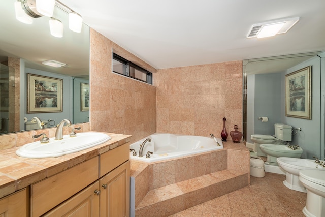 6301 Gulf Of Mexico Blvd Unit 301, Marathon, FL 33050 - full bathroom with toilet, vanity, tile walls, a bath, and a bidet