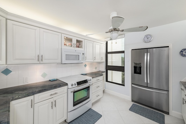 6301 Gulf Of Mexico Blvd Unit 301, Marathon, FL 33050 - kitchen featuring white appliances, white cabinets, decorative backsplash, glass insert cabinets, and light tile patterned flooring