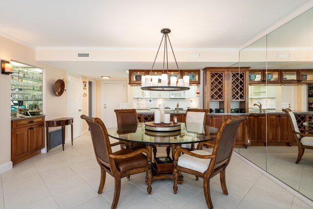 6301 Gulf Of Mexico Blvd Unit 301, Marathon, FL 33050 - dining space featuring visible vents, crown molding, and light tile patterned flooring