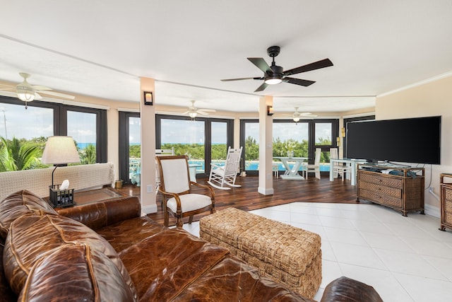 6301 Gulf Of Mexico Blvd Unit 301, Marathon, FL 33050 - living room with baseboards, crown molding, and light tile patterned flooring