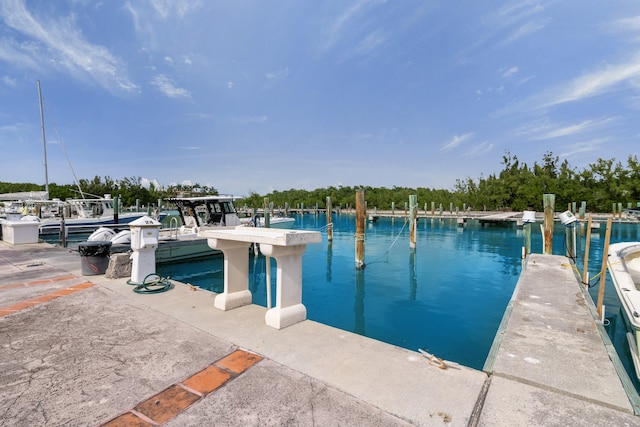 6301 Gulf Of Mexico Blvd Unit 301, Marathon, FL 33050 - view of swimming pool with a dock and a water view