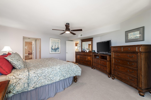 6301 Gulf Of Mexico Blvd Unit 301, Marathon, FL 33050 - bedroom featuring ensuite bathroom, a ceiling fan, visible vents, and light colored carpet