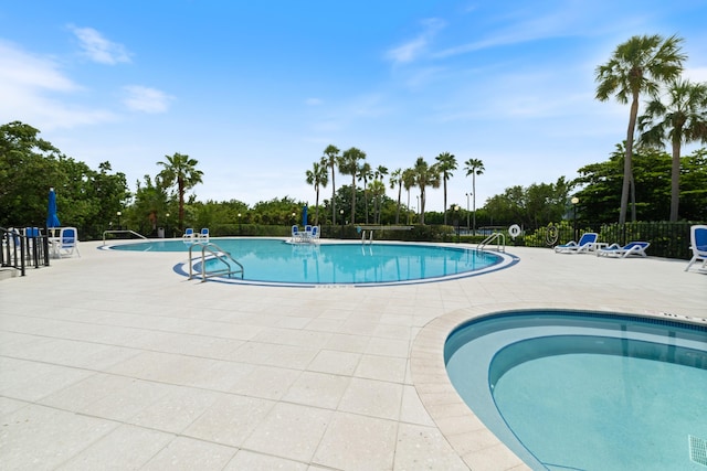 6301 Gulf Of Mexico Blvd Unit 301, Marathon, FL 33050 - community pool with a patio area and fence