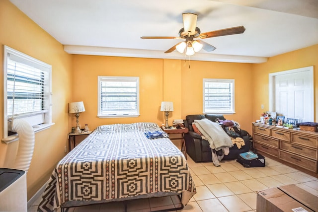 bedroom featuring light tile patterned floors and a ceiling fan