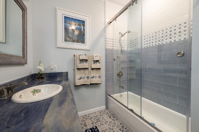 bathroom featuring vanity, shower / bath combination with glass door, and tile patterned flooring