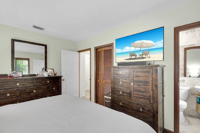 bedroom featuring connected bathroom