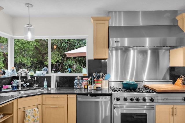 kitchen featuring light brown cabinetry, sink, tasteful backsplash, and appliances with stainless steel finishes