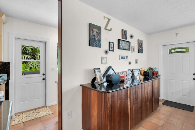 foyer featuring a textured ceiling