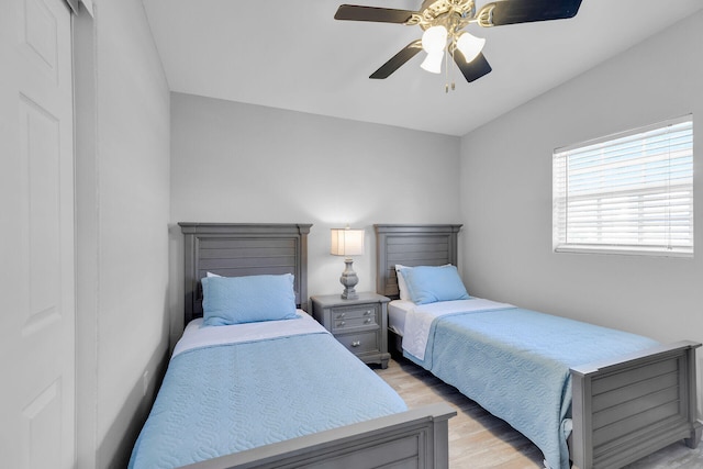 bedroom featuring light wood-style floors and a ceiling fan