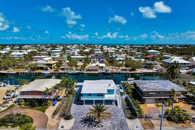 aerial perspective of suburban area with a large body of water
