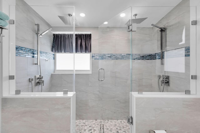 full bathroom featuring a shower stall and recessed lighting