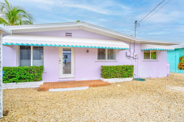 263 Azalea St, Tavernier, FL 33070 - view of front of property with stucco siding