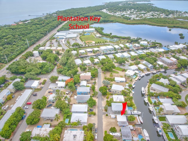 263 Azalea St, Tavernier, FL 33070 - aerial perspective of suburban area with a large body of water