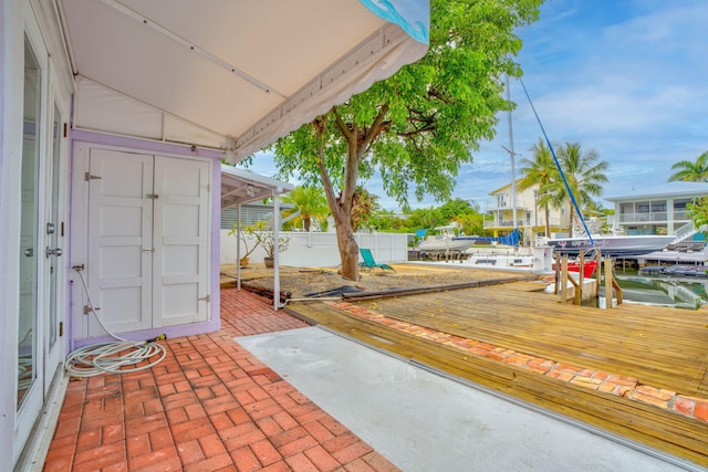 263 Azalea St, Tavernier, FL 33070 - view of patio featuring a boat dock