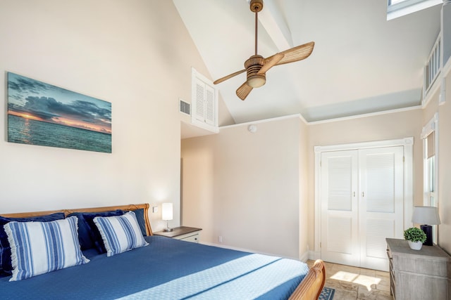 bedroom featuring high vaulted ceiling, a closet, visible vents, and a ceiling fan