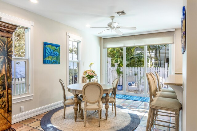 dining space featuring baseboards, visible vents, ceiling fan, and recessed lighting