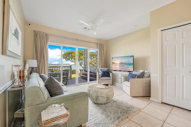 living room with light tile patterned flooring and ceiling fan