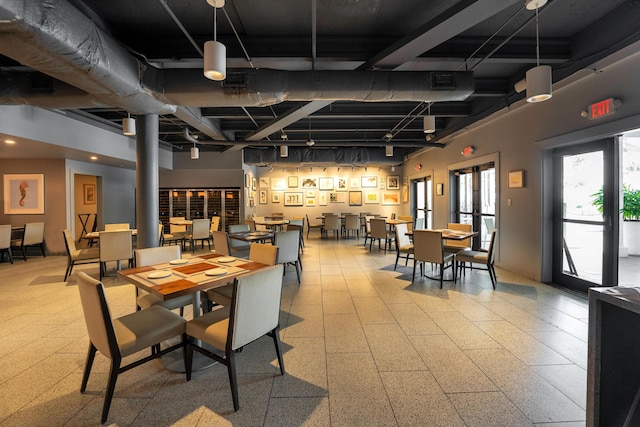 dining room with a towering ceiling