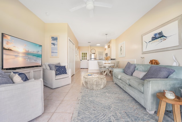 tiled living room with ceiling fan