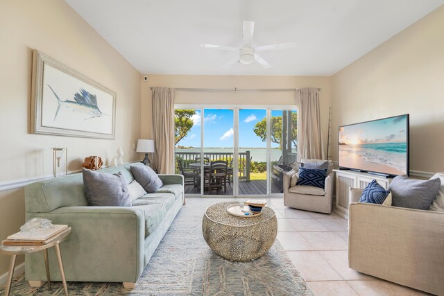 tiled living room with ceiling fan