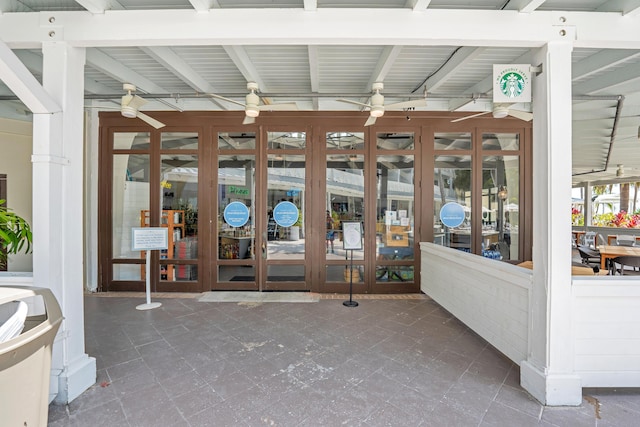 interior space with ceiling fan