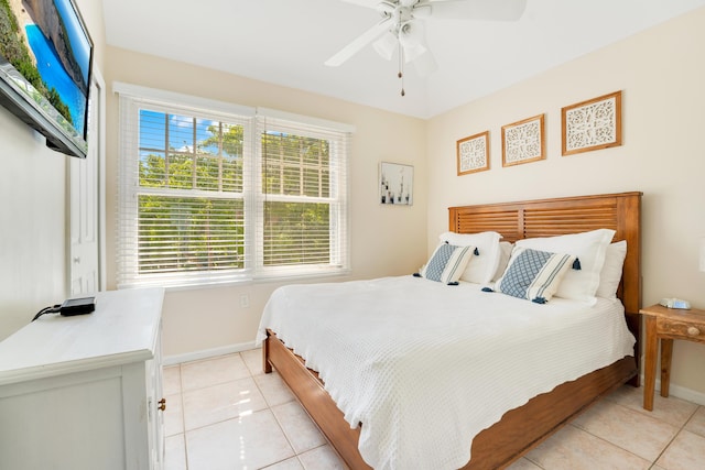 bedroom featuring light tile patterned flooring and ceiling fan