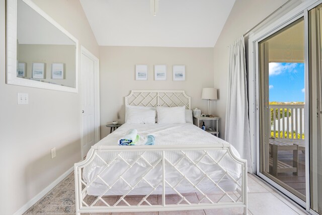 tiled bedroom featuring lofted ceiling and access to exterior