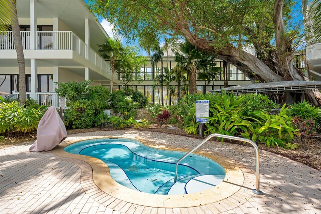 view of swimming pool featuring a patio