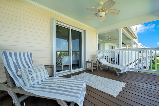 wooden deck with ceiling fan