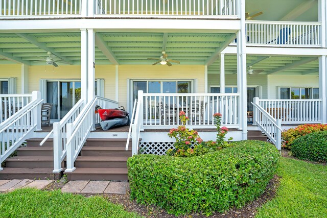 doorway to property featuring ceiling fan