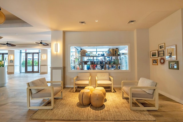 interior space featuring light hardwood / wood-style floors and ceiling fan