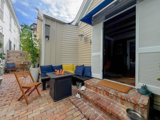 view of patio featuring an outdoor fire pit