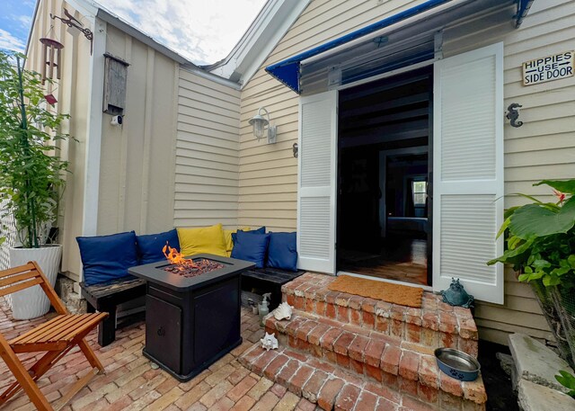 view of patio with a fire pit