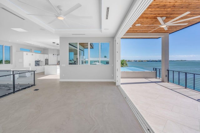 interior space featuring a water view and ceiling fan