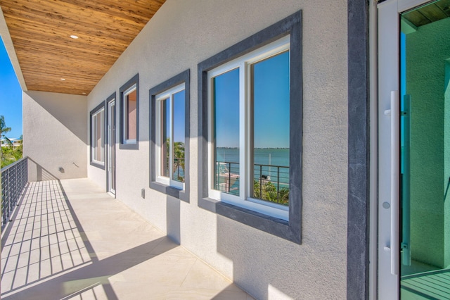 balcony featuring a water view