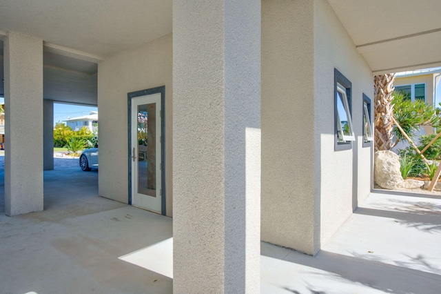 entrance to property featuring a patio area