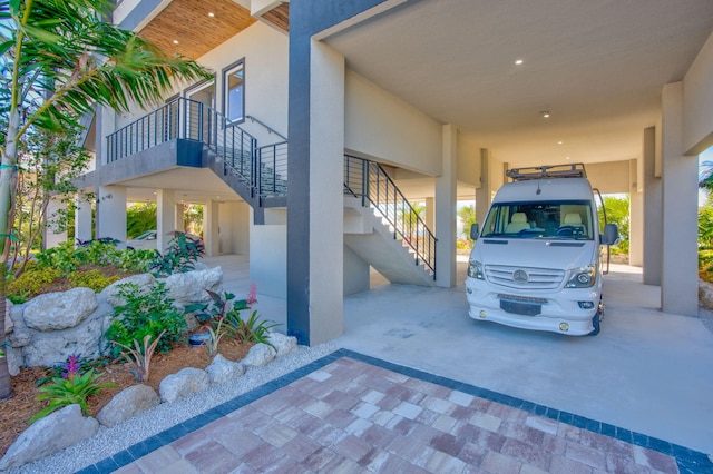 exterior space with a carport