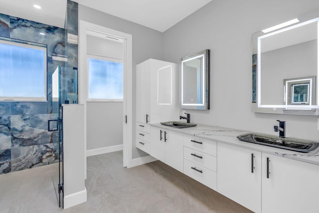 bathroom with vanity and walk in shower