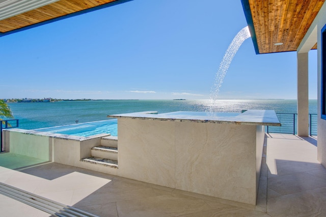 view of patio / terrace featuring a water view