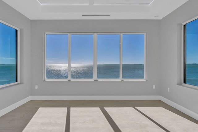 empty room featuring a water view