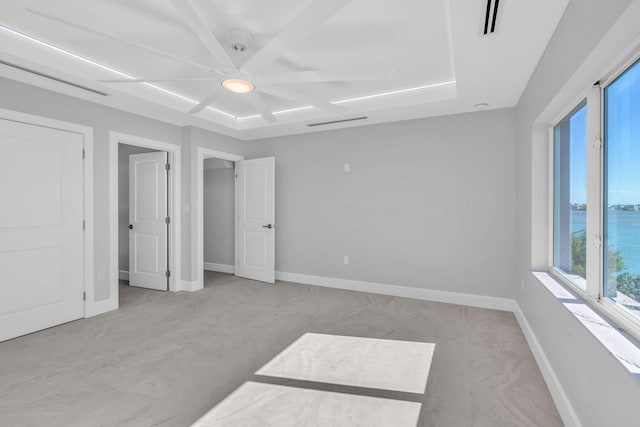 bedroom featuring a water view and ceiling fan