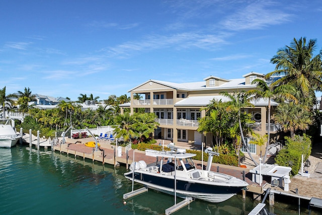 view of dock with boat lift and a water view