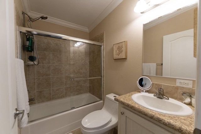 full bathroom with vanity, ornamental molding, enclosed tub / shower combo, and toilet