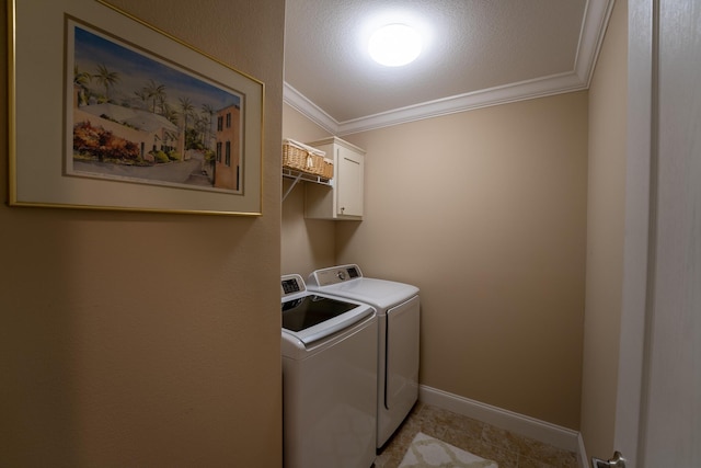 laundry area featuring cabinets, independent washer and dryer, and ornamental molding