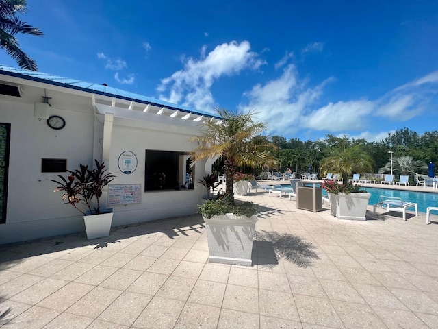 view of patio featuring a community pool