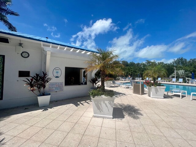 view of patio featuring a community pool