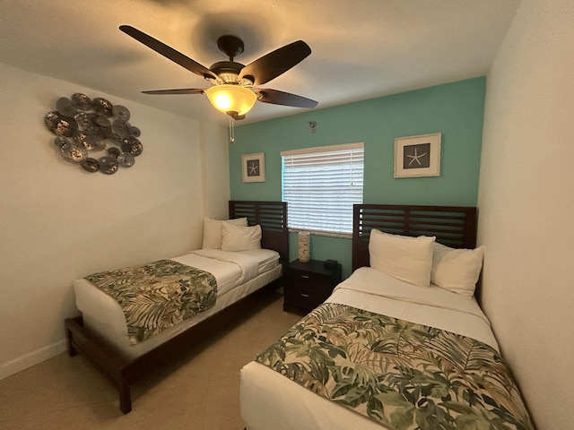 bedroom featuring tile patterned flooring and ceiling fan